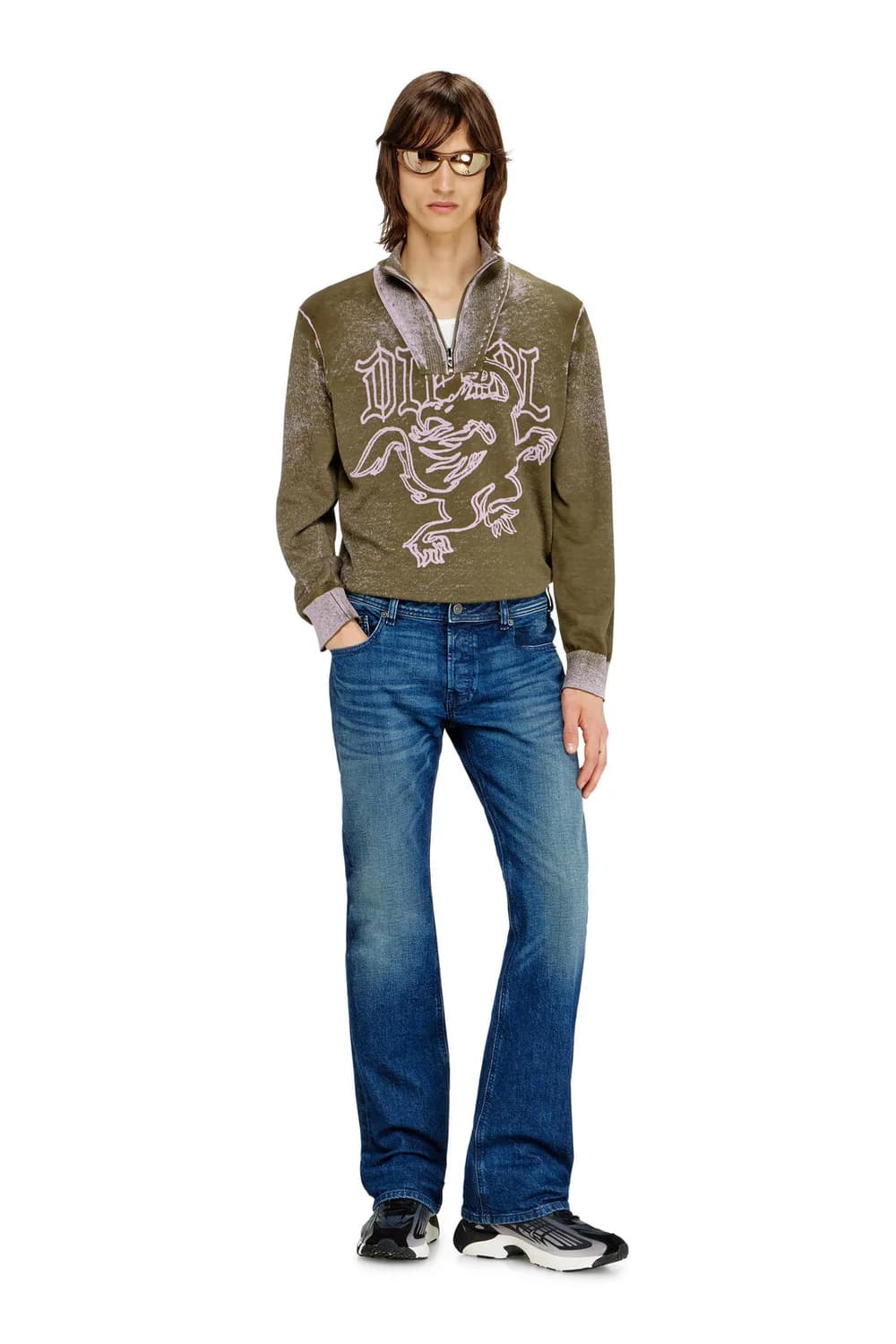 Male model wearing modern bootcut denim jeans.