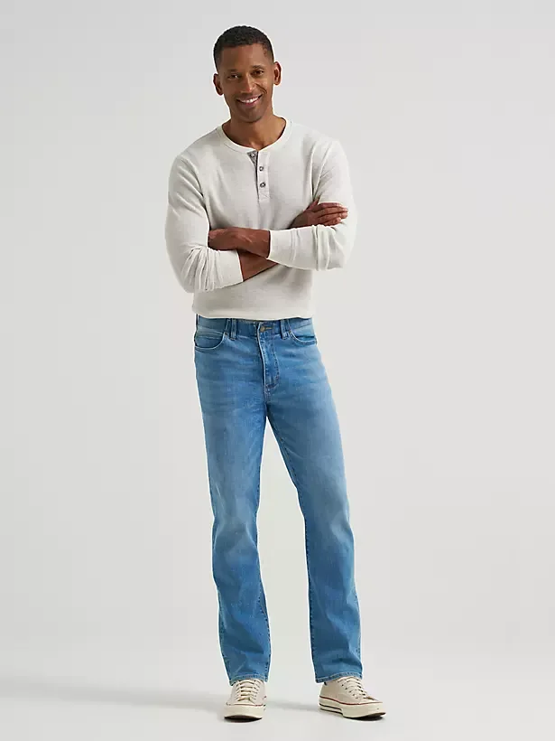 Male model wearing slim fit blue denim jeans.