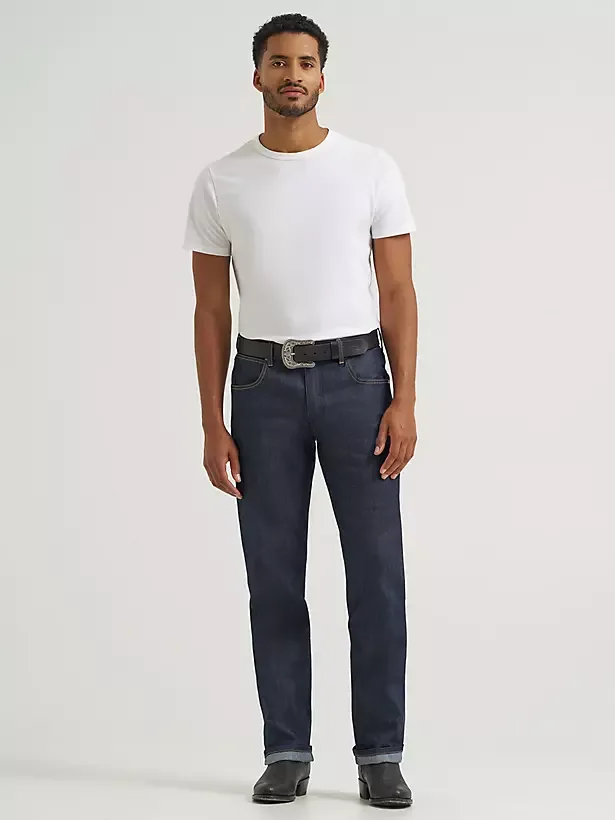 Male model wearing straight leg denim jeans.