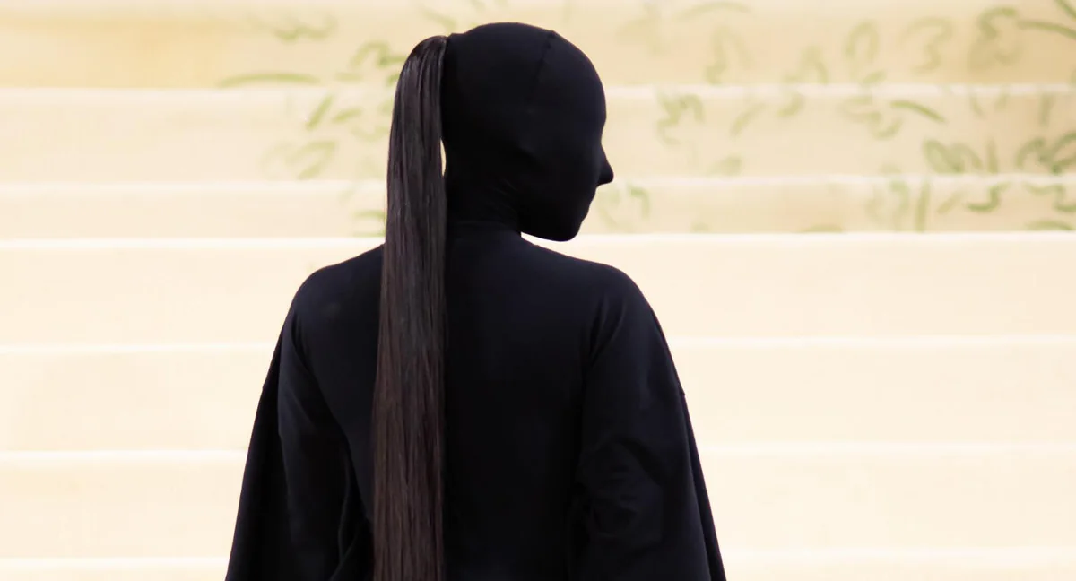 Kim Kardashian wearing a fully black Balenciaga face-covering look at the 2021 Met Gala.