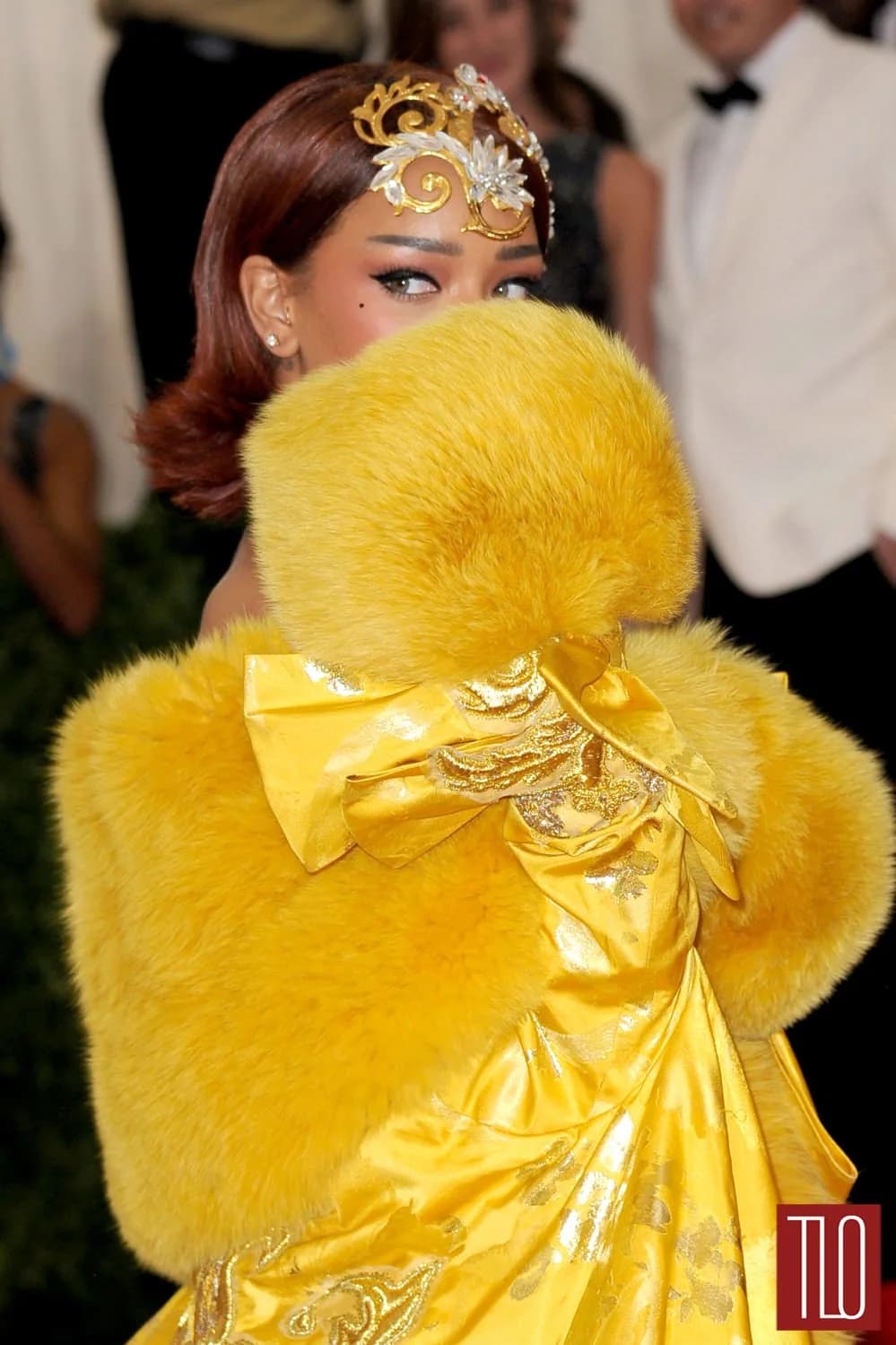Rihanna wearing Guo Pei yellow couture with a massive train at the 2015 Met Gala.
