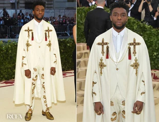 Chadwick Boseman wearing an ivory Versace cape and white tuxedo at the 2018 Met Gala.