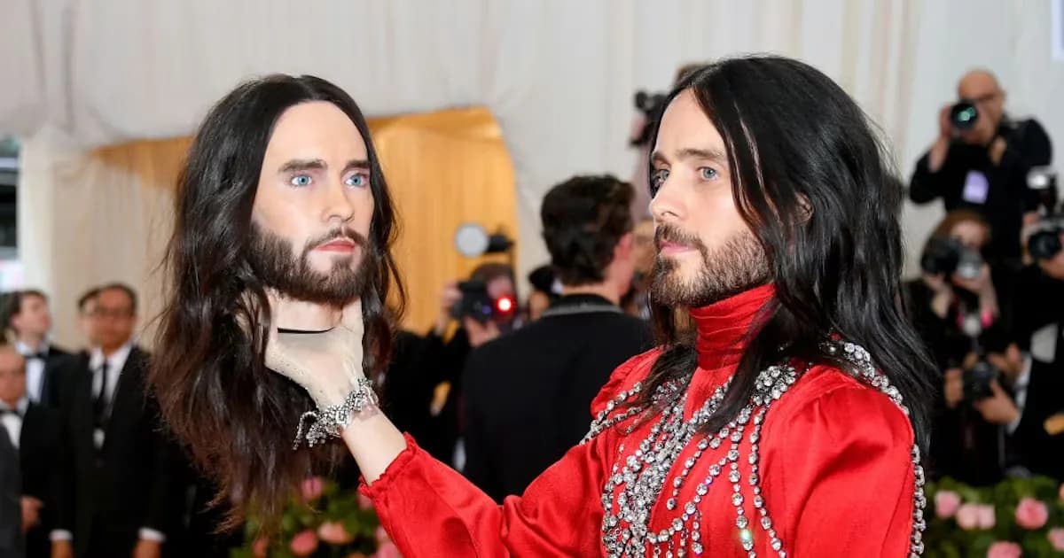 Jared Leto carrying a replica of his own head while wearing Gucci at the 2019 Met Gala.