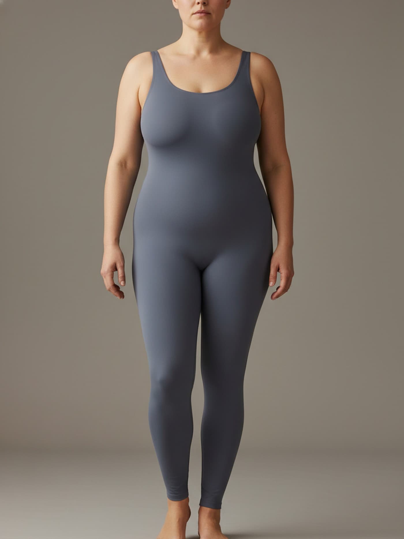 Adult woman with apple body proportions in fitted neutral clothing, shown front-facing for anatomical reference.