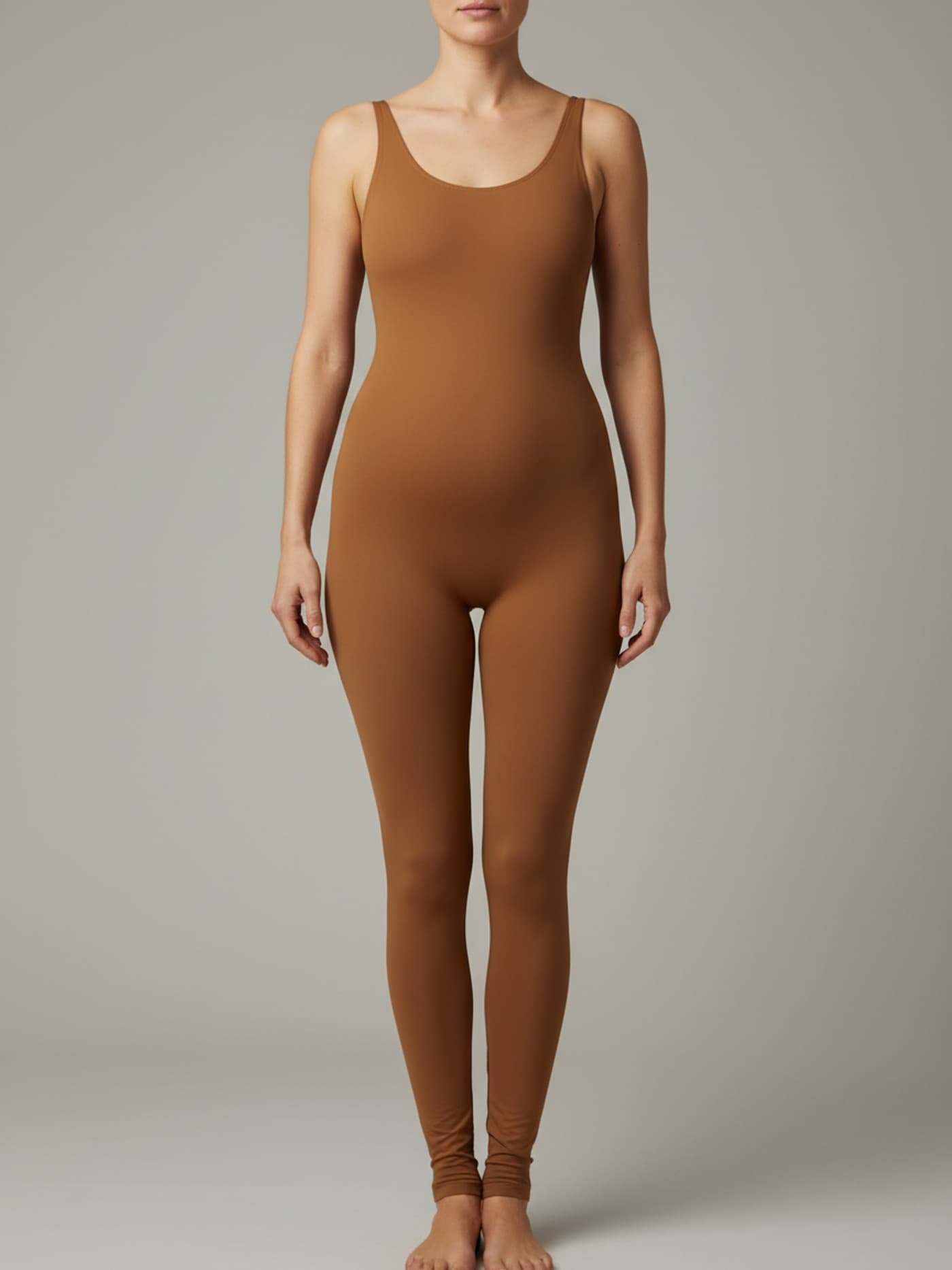 Adult woman with diamond body proportions in fitted neutral clothing, shown front-facing for anatomical reference.