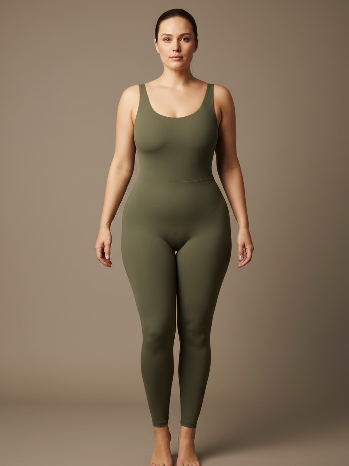 Adult woman with spoon body proportions in fitted neutral clothing, shown front-facing for anatomical reference.