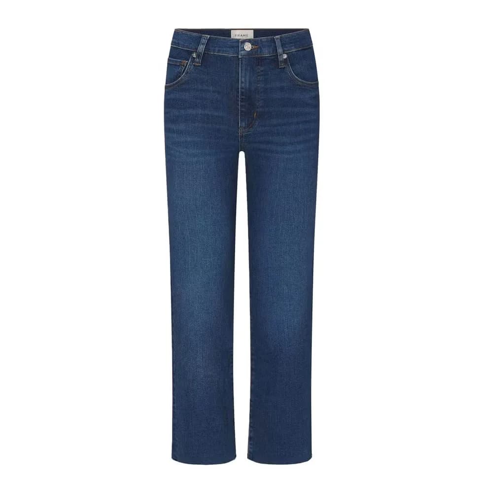 Woman wearing ankle-cropped jeans that expose the shoe line.