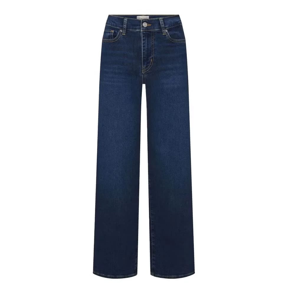 Woman wearing dark indigo denim suitable for elevated styling.