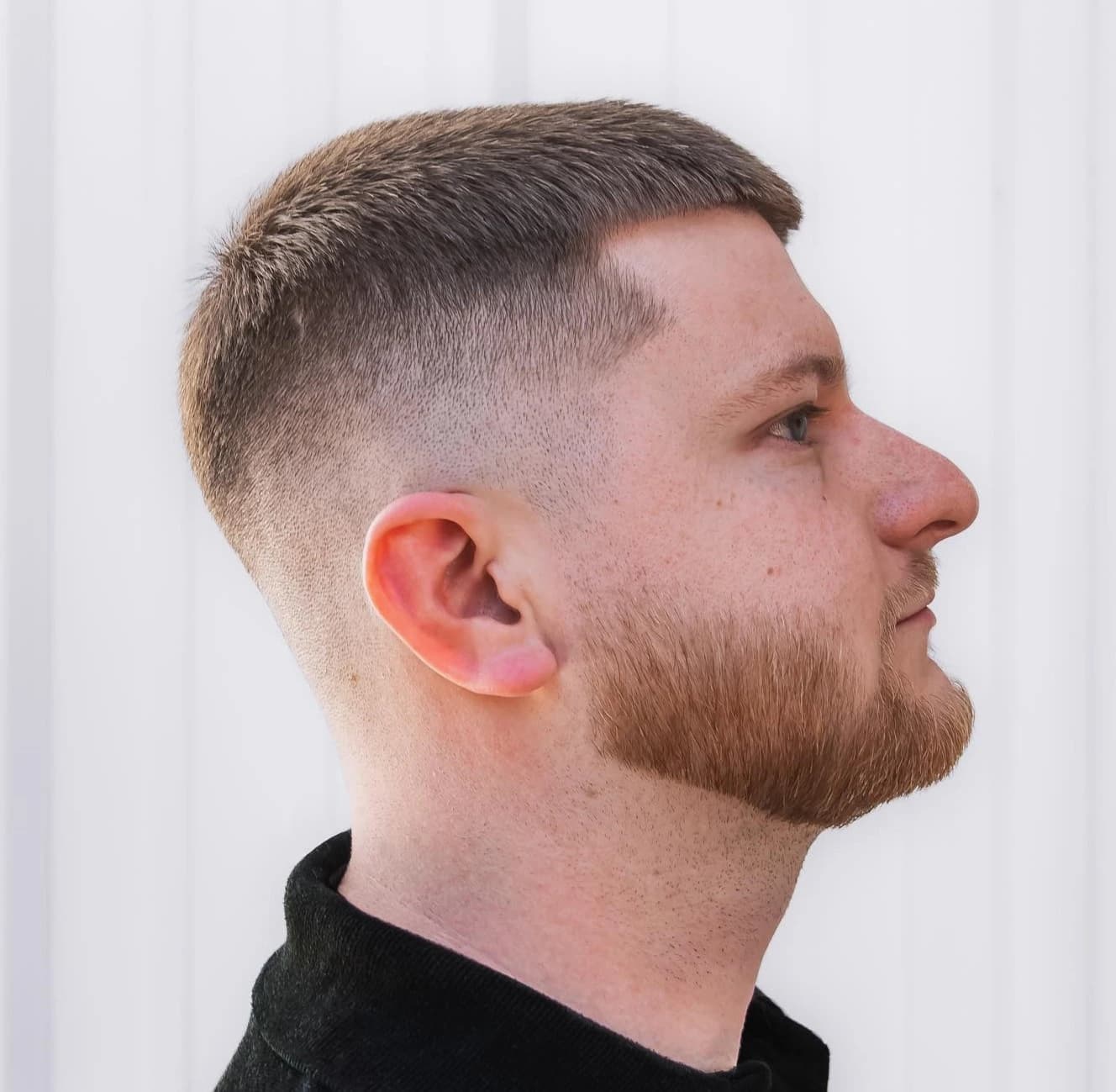 Secondary reference image for The Grown-Out Buzz Cut with Geometric Line-Up and Fade.